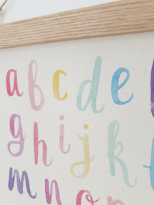 Alphabet canvas print with wooden hanger